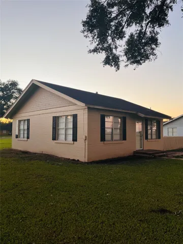 a house that has a big yard in front of it