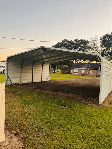 a view of a balcony next to a yard