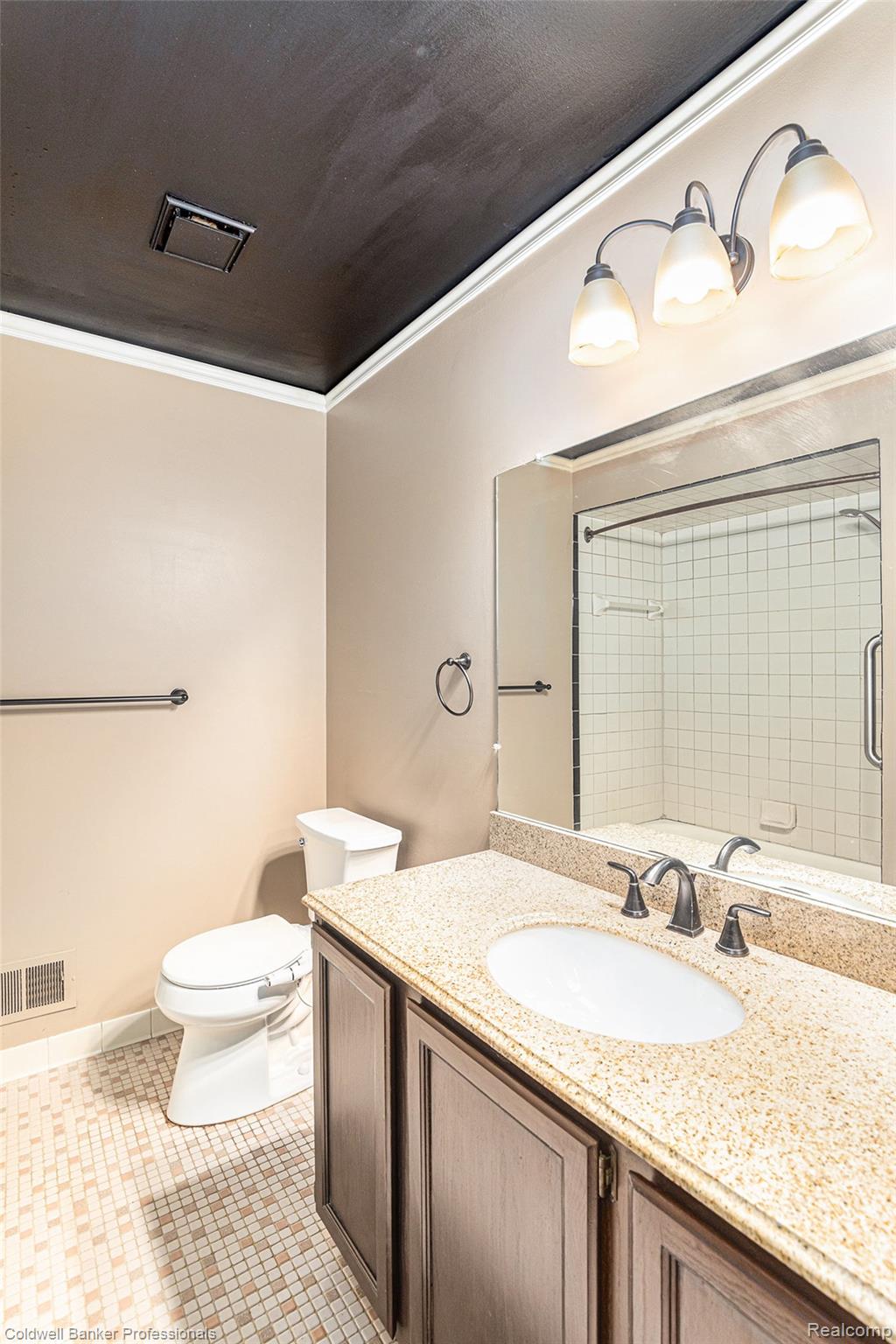 57295 Beaconsfield Road Washington, MI 48094 - Photo 13 of 20 Bathroom featuring vanity, light tile patterned floors, and crown molding