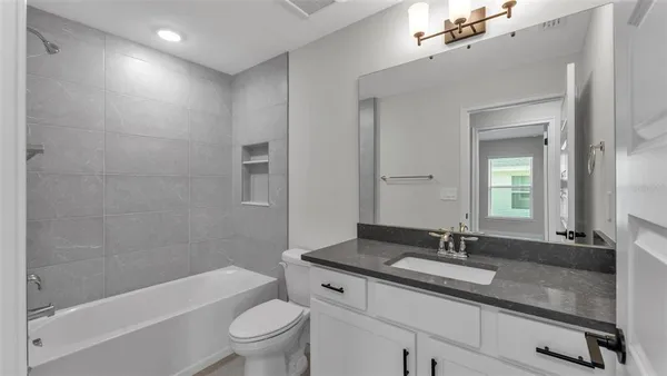 a bathroom with a shower and a toilet