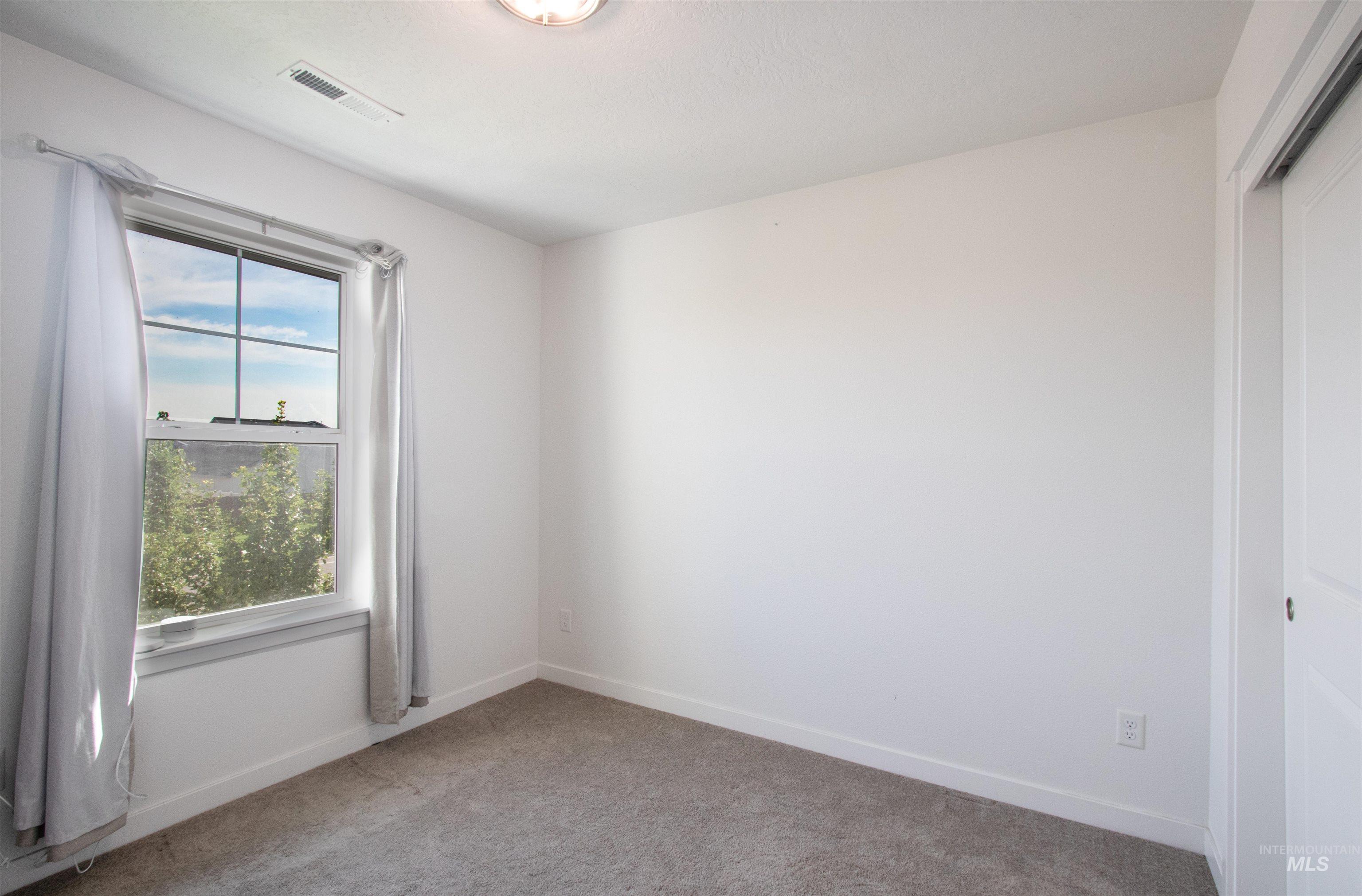 7698 South Seabreeze Way Boise, ID 83709 - Photo 10 of 16 Carpeted empty room with baseboards