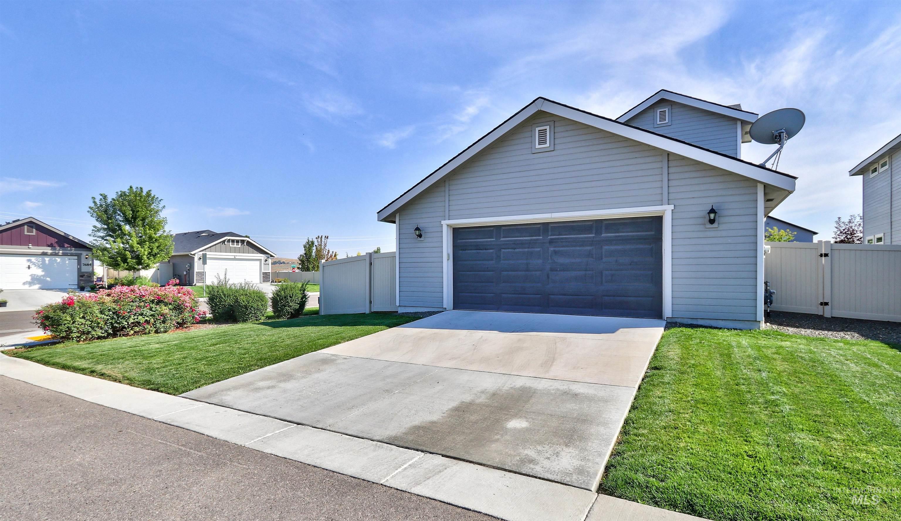 7698 South Seabreeze Way Boise, ID 83709 - Photo 3 of 16 View of front facade with a gate and driveway