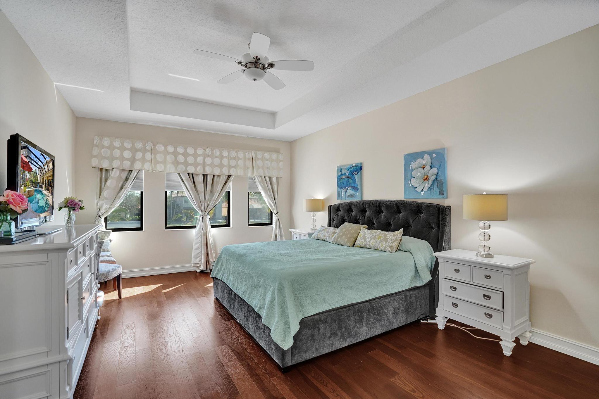 16610 Gateway Bridge Drive Delray Beach, FL 33446 - Photo 11 of 67 a bedroom with a bed and a flat tv screen on the dresser