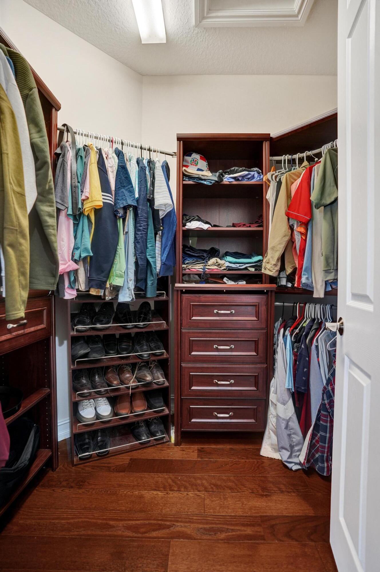 16610 Gateway Bridge Drive Delray Beach, FL 33446 - Photo 15 of 67 a view of walk in closet with clothes and shoes
