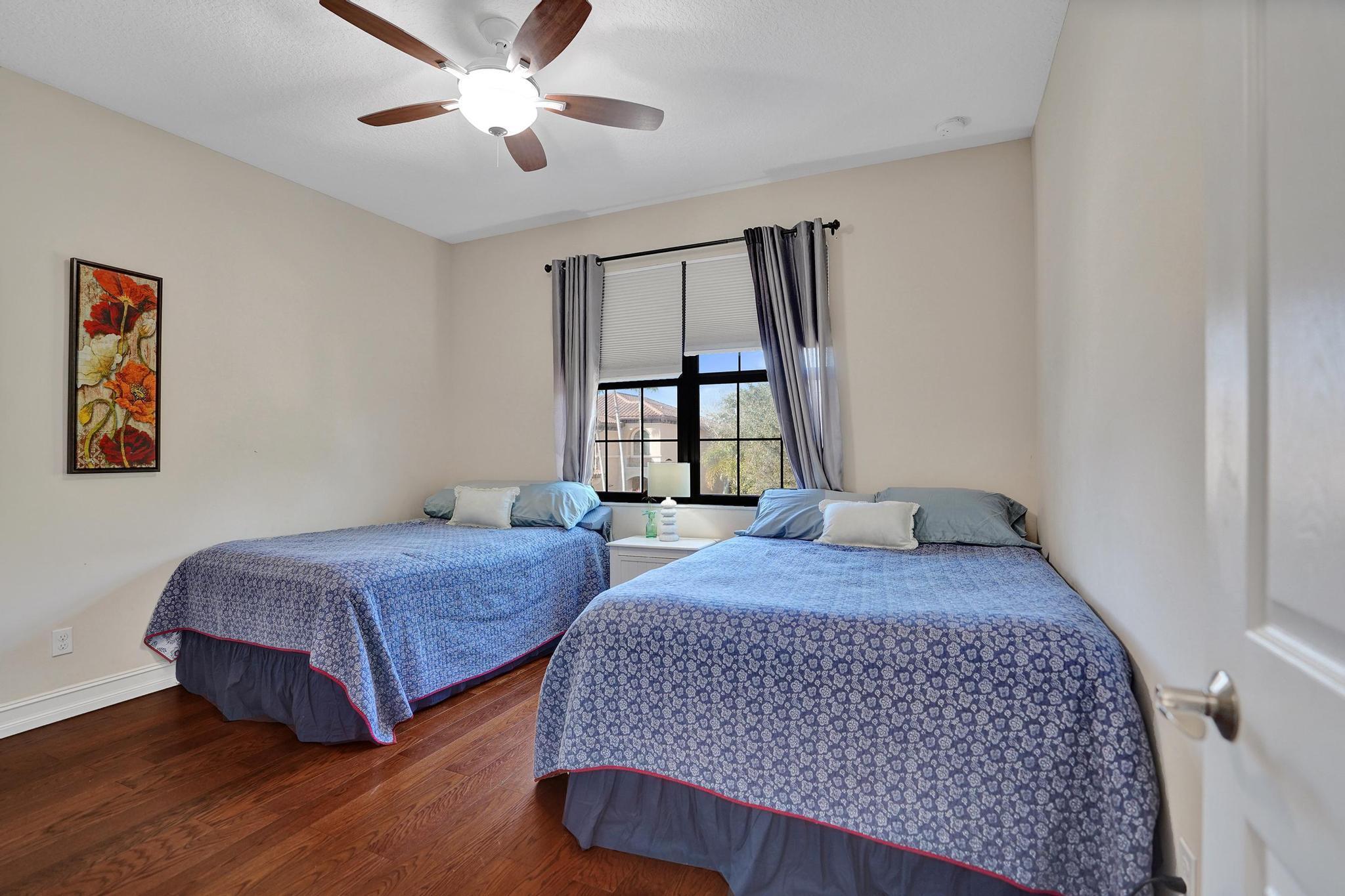 16610 Gateway Bridge Drive Delray Beach, FL 33446 - Photo 16 of 67 a bedroom with two beds and a window