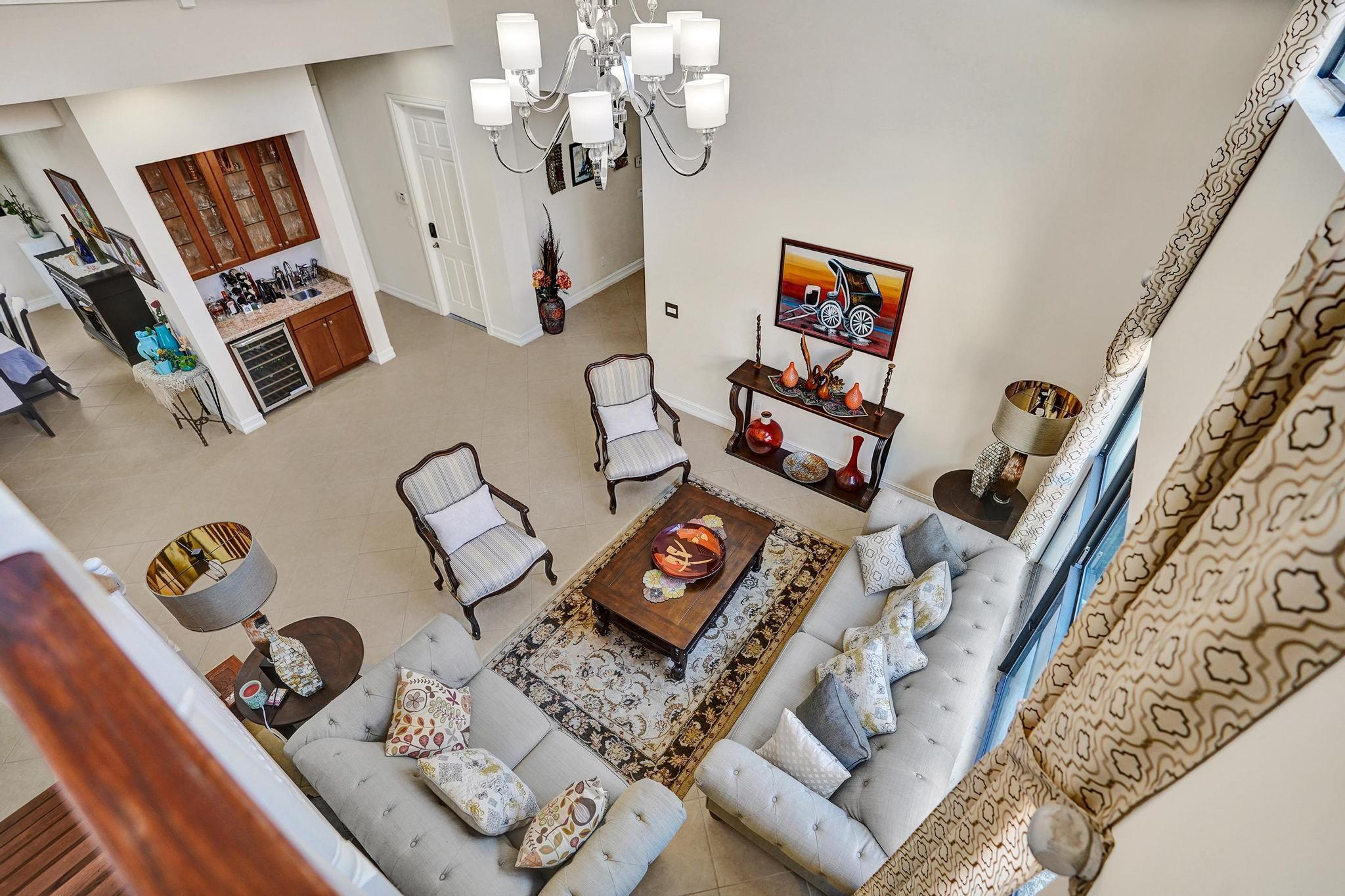 16610 Gateway Bridge Drive Delray Beach, FL 33446 - Photo 3 of 67 a living room with furniture and a flat screen tv