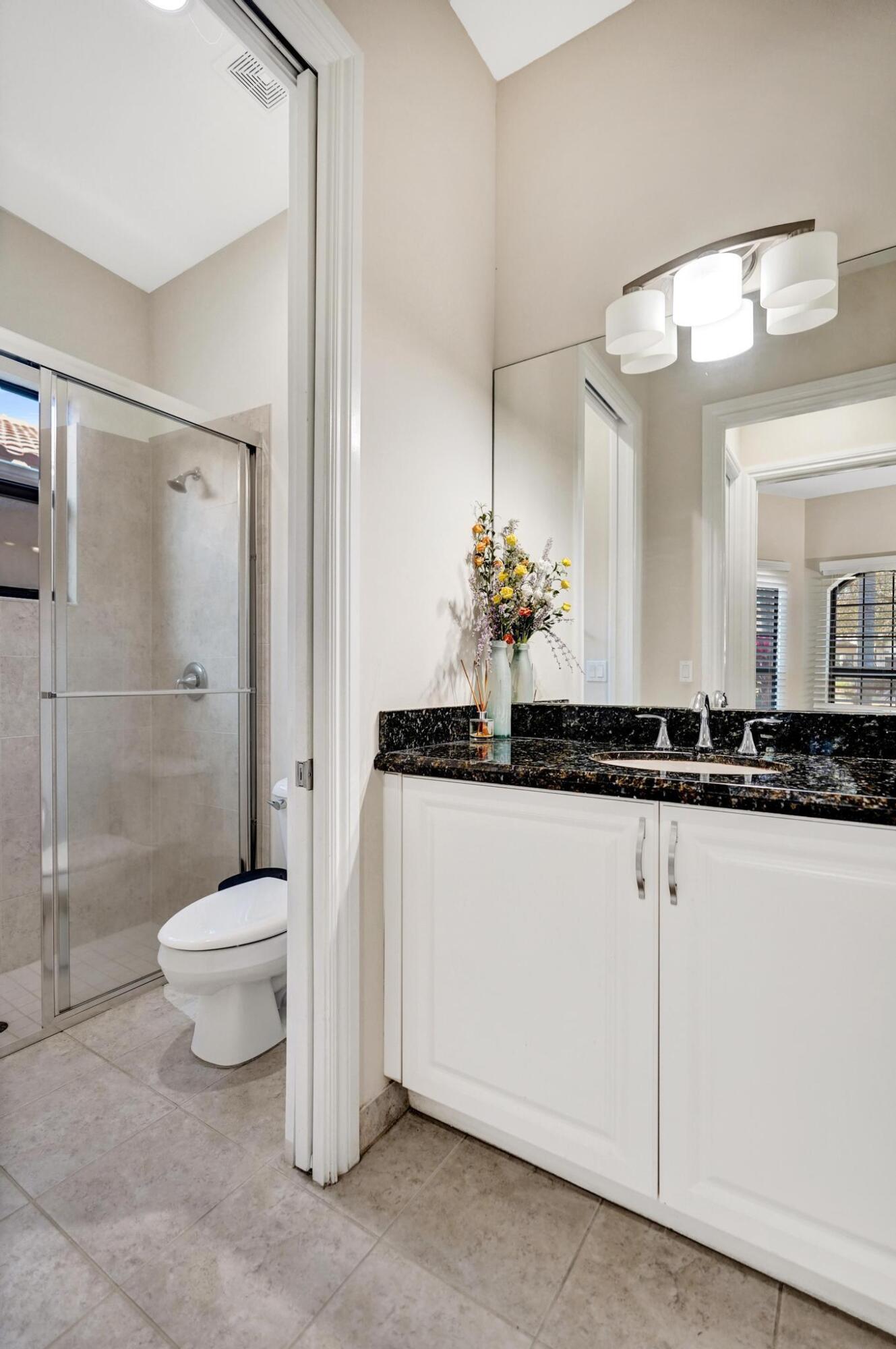 16610 Gateway Bridge Drive Delray Beach, FL 33446 - Photo 31 of 67 a bathroom with a sink toilet and shower