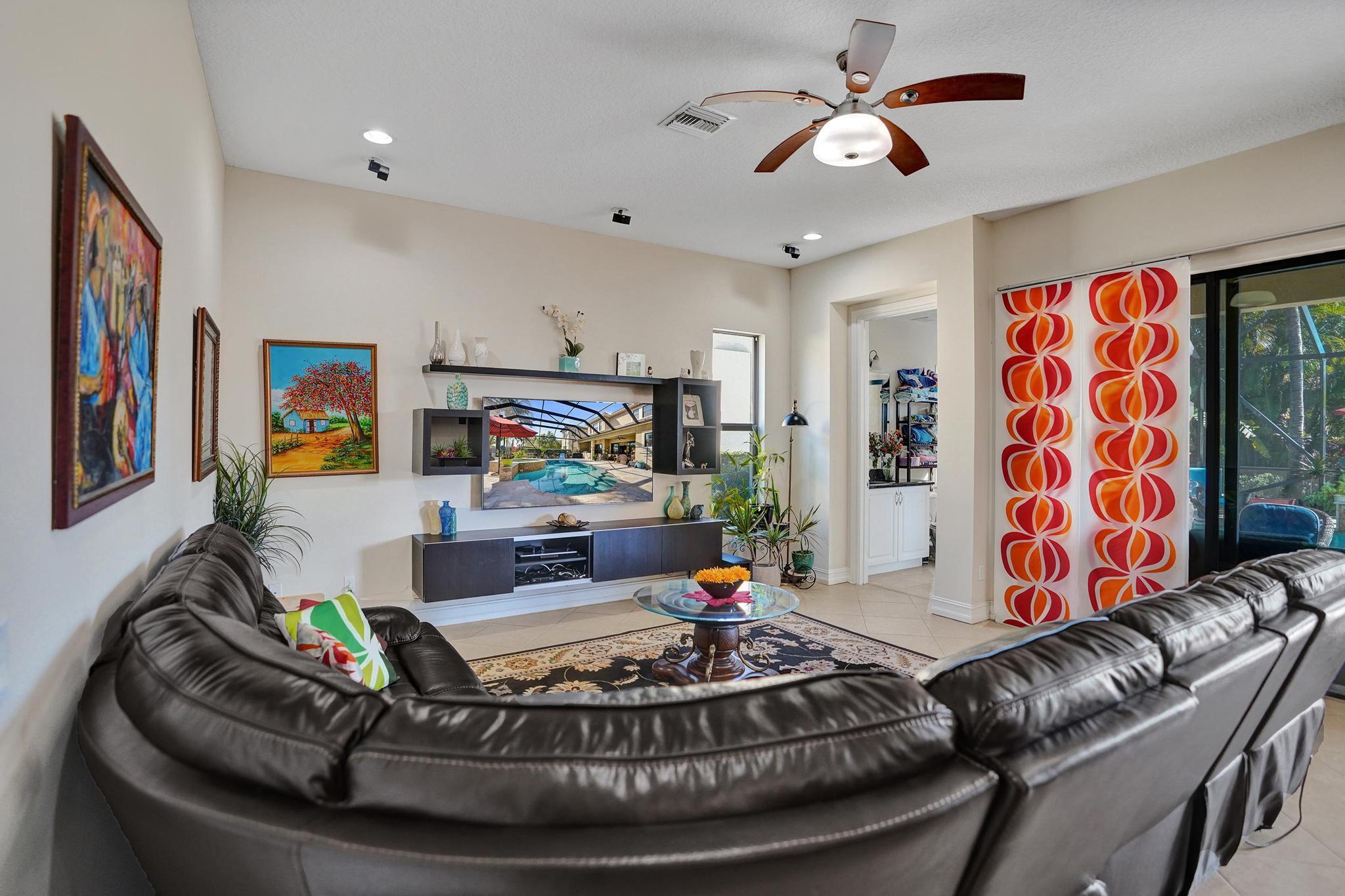 16610 Gateway Bridge Drive Delray Beach, FL 33446 - Photo 8 of 67 a living room with furniture and a chandelier