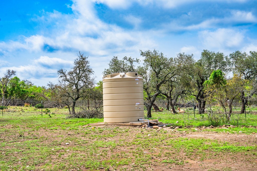 563 J J B Road Harper, TX 78631 - Photo 20 of 40 a view of a house with a yard and large trees