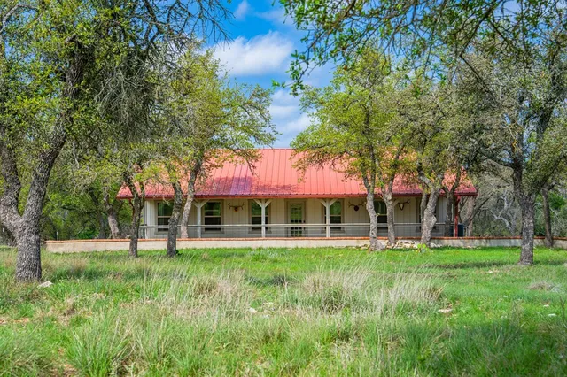 a view of a house with a yard porch and sitting area