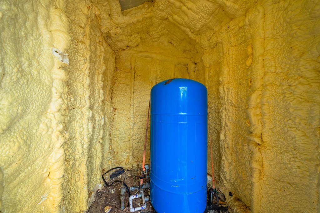 563 J J B Road Harper, TX 78631 - Photo 21 of 40 a bathroom with a sink and a shower curtain