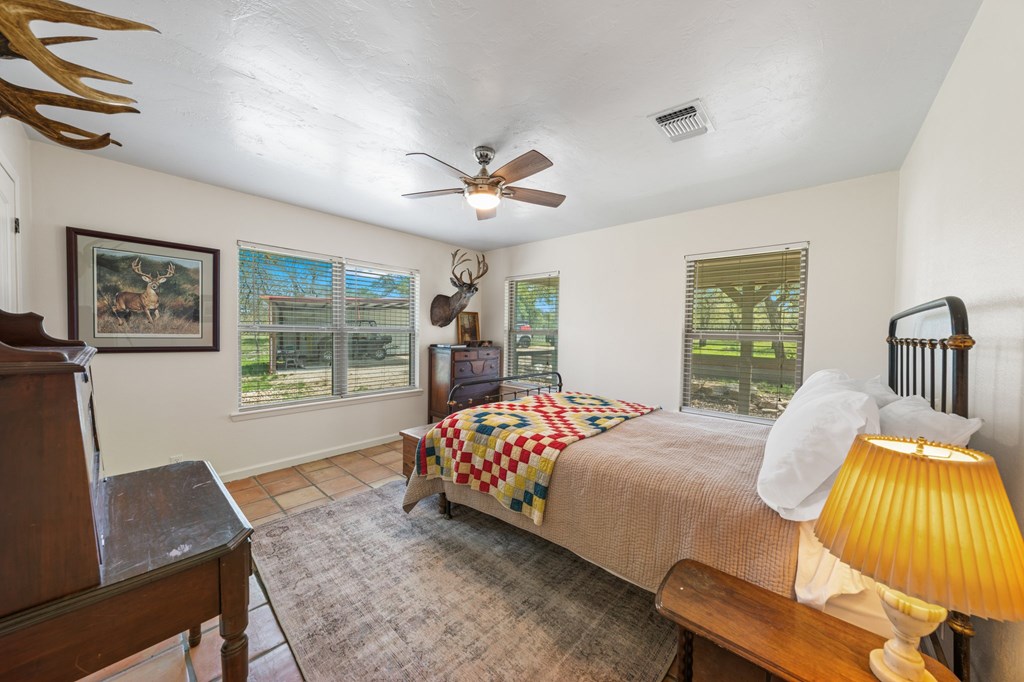 563 J J B Road Harper, TX 78631 - Photo 10 of 40 a bedroom with a bed and a window