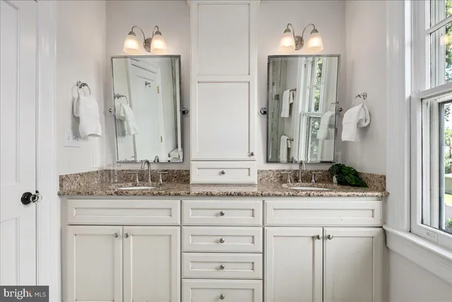 a kitchen that has a sink and a stove in it