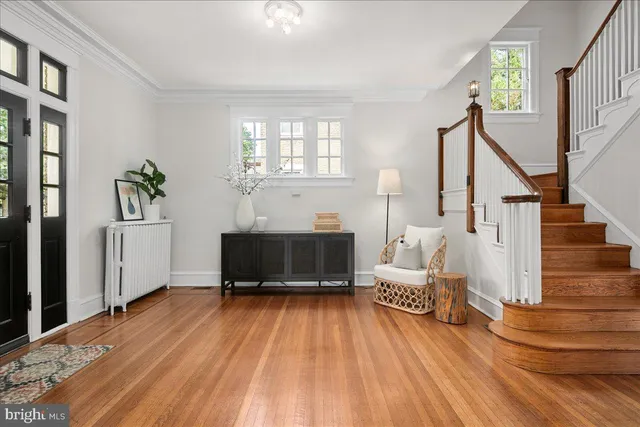 a view of livingroom with dining room and wooden floor