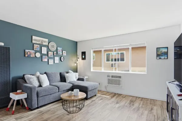 a living room with furniture and a window