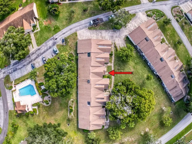 an aerial view of house with yard