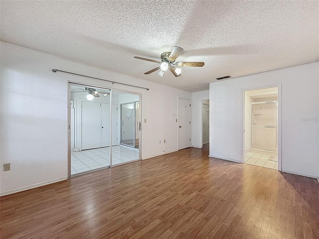11403 Versailles Lane, Unit E Port Richey, FL 34668 - Photo 23 of 74 a view of an empty room with a window