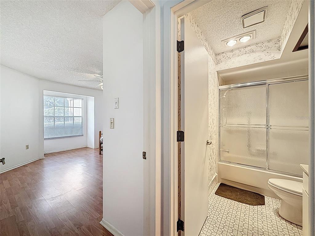 11403 Versailles Lane, Unit E Port Richey, FL 34668 - Photo 31 of 74 a bathroom with a toilet and a shower