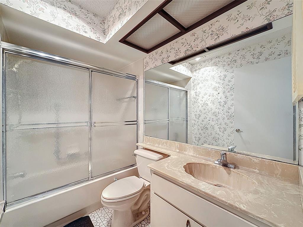 11403 Versailles Lane, Unit E Port Richey, FL 34668 - Photo 32 of 74 a bathroom with a sink and a toilet