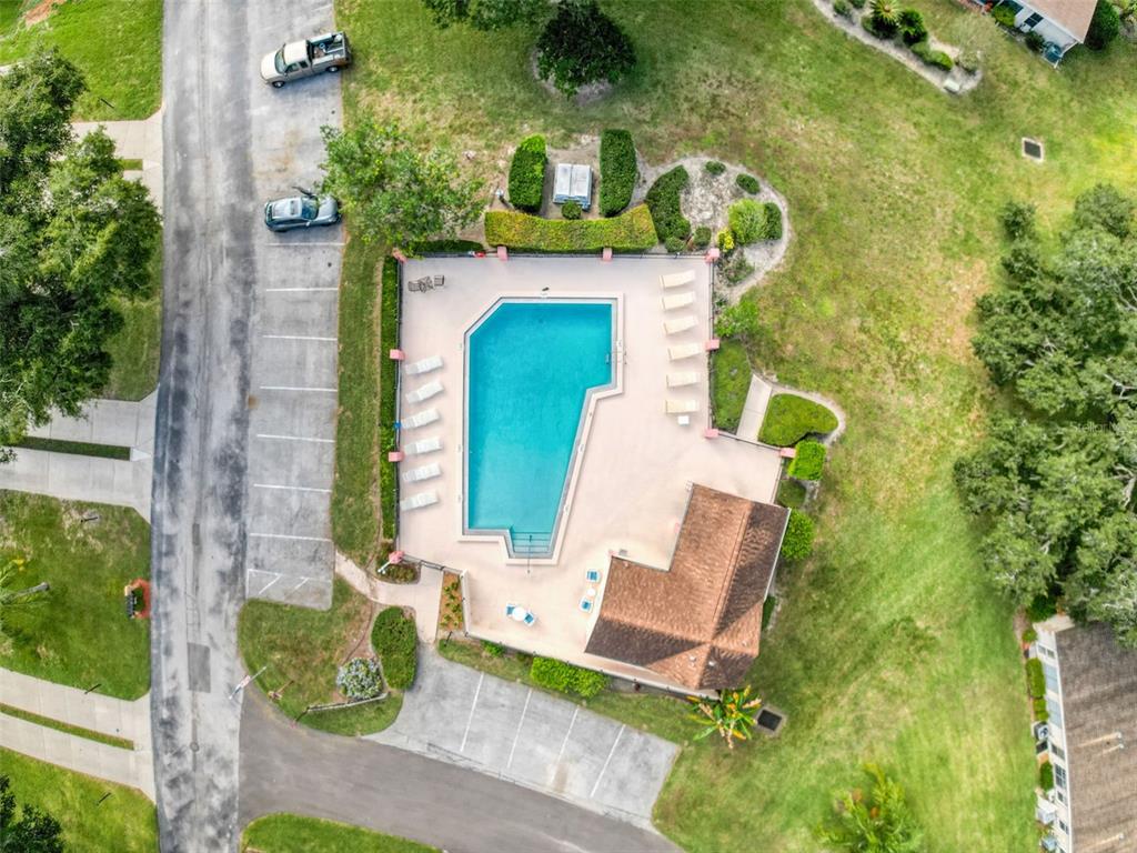 11403 Versailles Lane, Unit E Port Richey, FL 34668 - Photo 41 of 74 an aerial view of a house with a yard