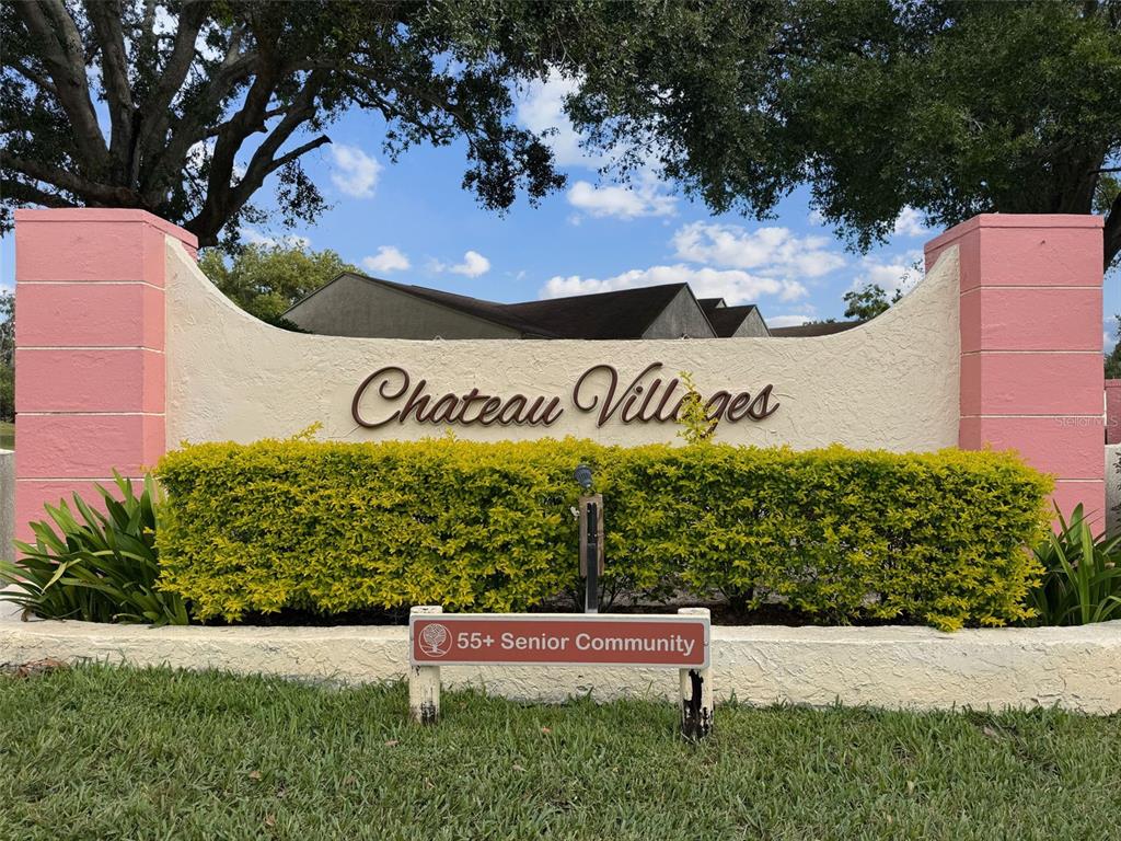 11403 Versailles Lane, Unit E Port Richey, FL 34668 - Photo 43 of 74 a view of outdoor space with sign board
