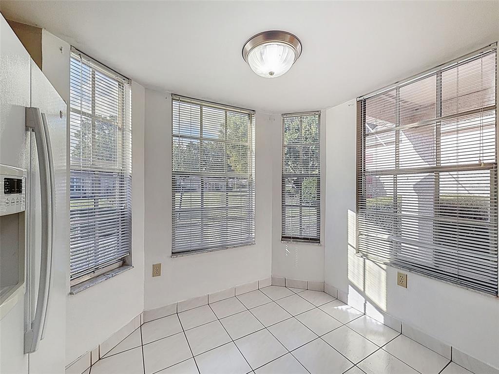 11403 Versailles Lane, Unit E Port Richey, FL 34668 - Photo 8 of 74 a view of an empty room with a window