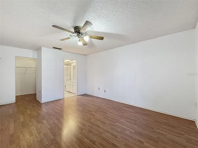 a bathroom with a granite countertop sink mirror and vanity