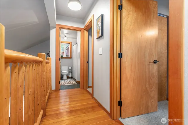 a view of a bathroom with shower and a mirror