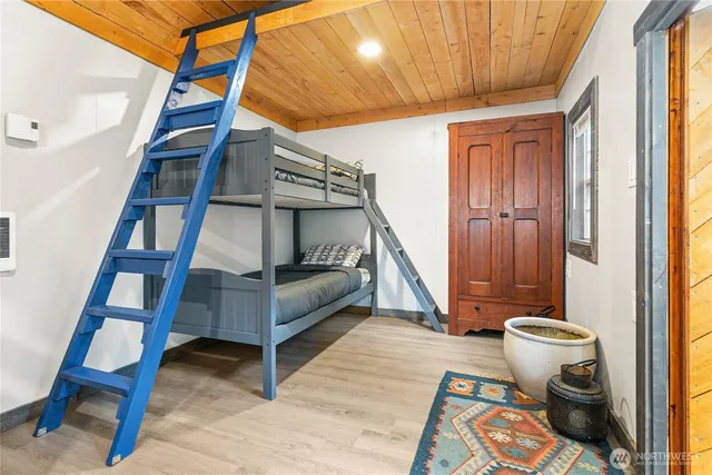 a view of entryway with furniture and front door