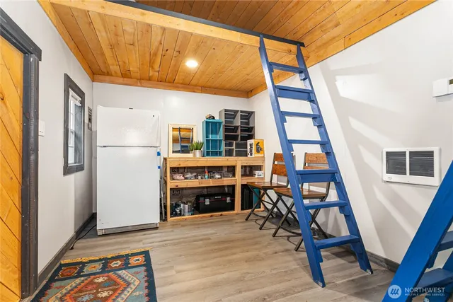 a view of a livingroom with furniture and workspace