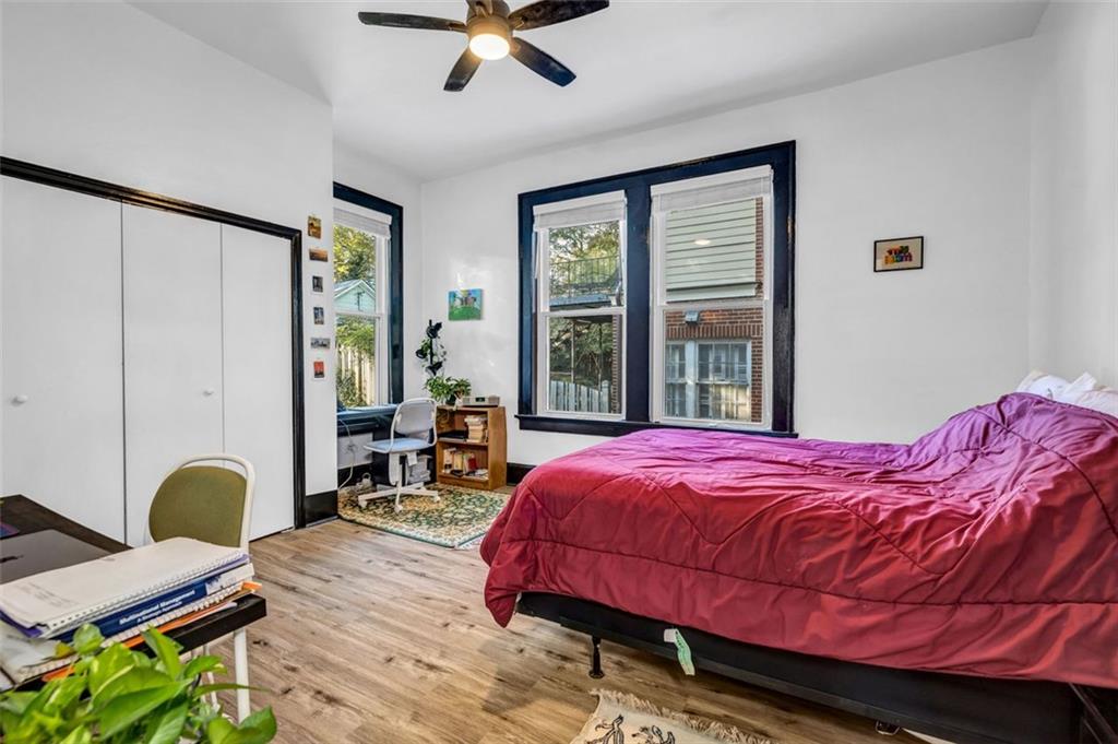 800 Myrtle Street Northeast Atlanta, GA 30308 - Photo 19 of 28 a bedroom with a bed window and table