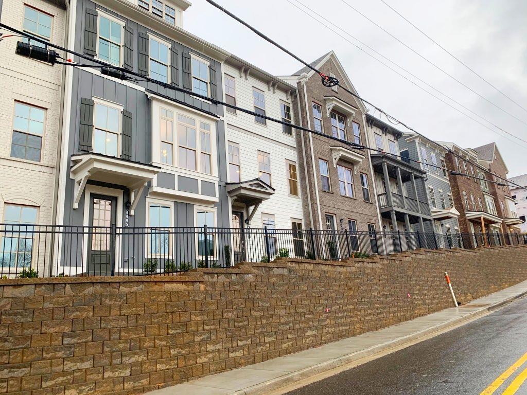 6023 Skellig Street Norcross, GA 30071 - Photo 1 of 1 a large building with a street