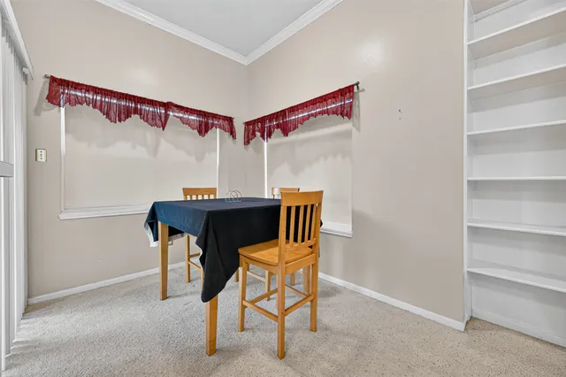 a dining room with furniture and a table & chairs