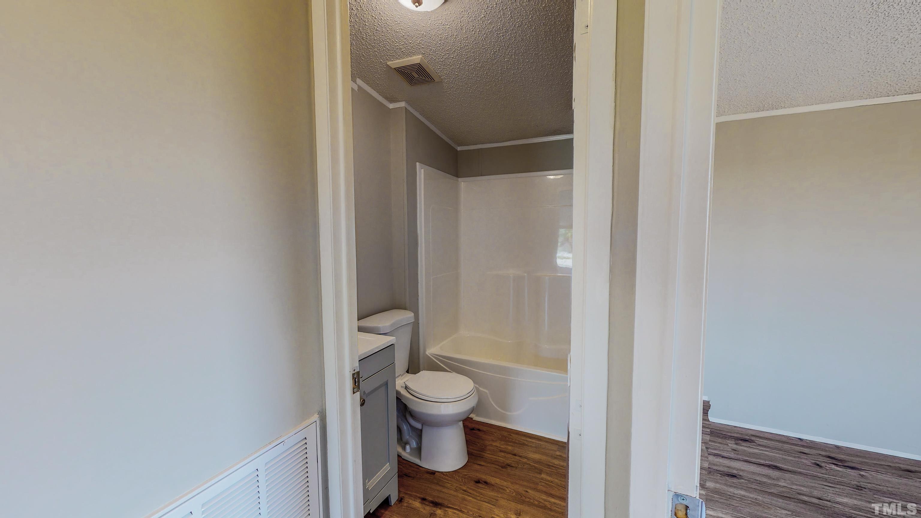 552 Huff Road Roxboro, NC 27574 - Photo 33 of 43 a bathroom with a toilet and a shower