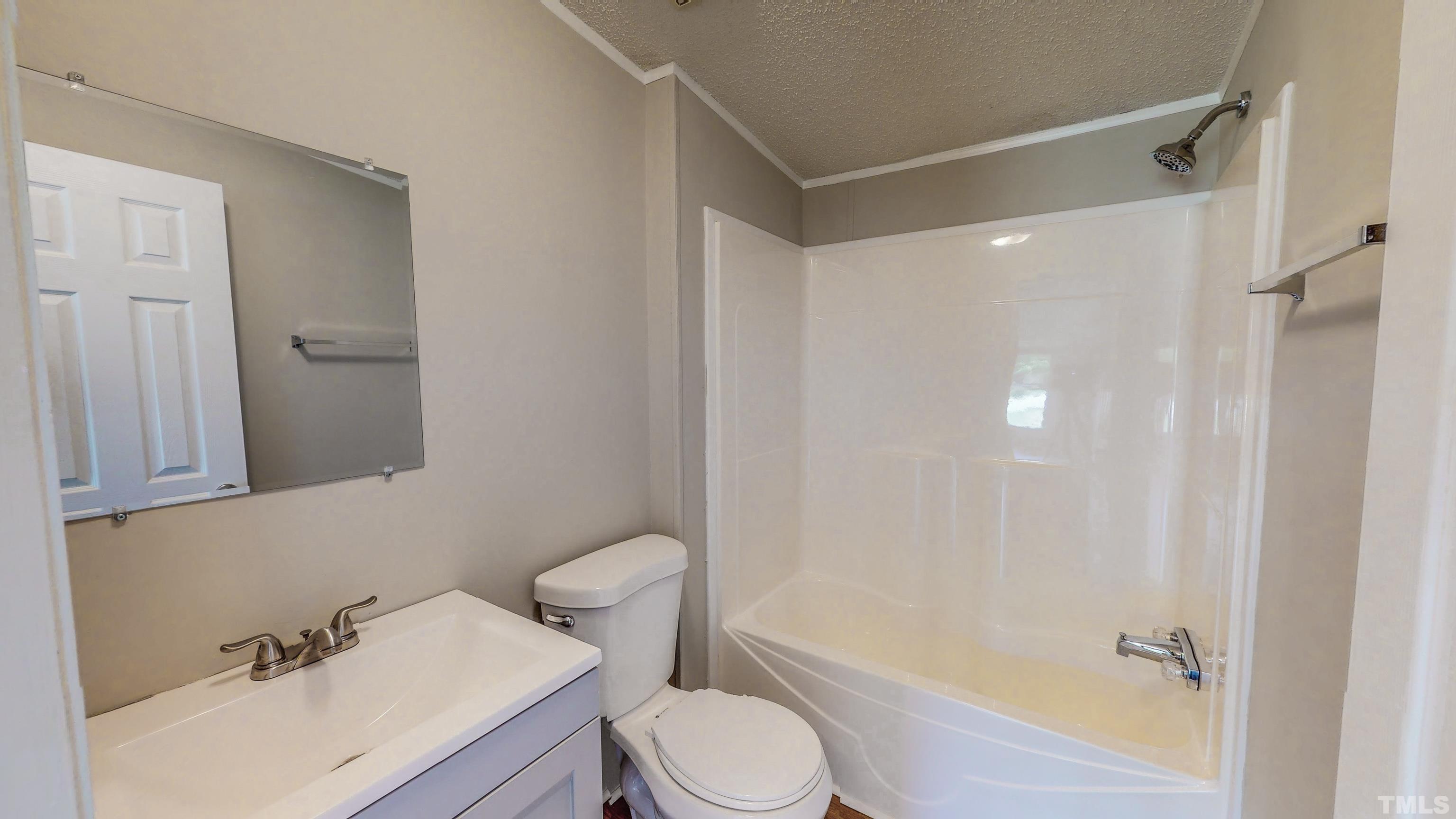 552 Huff Road Roxboro, NC 27574 - Photo 34 of 43 a bathroom with a sink toilet and shower