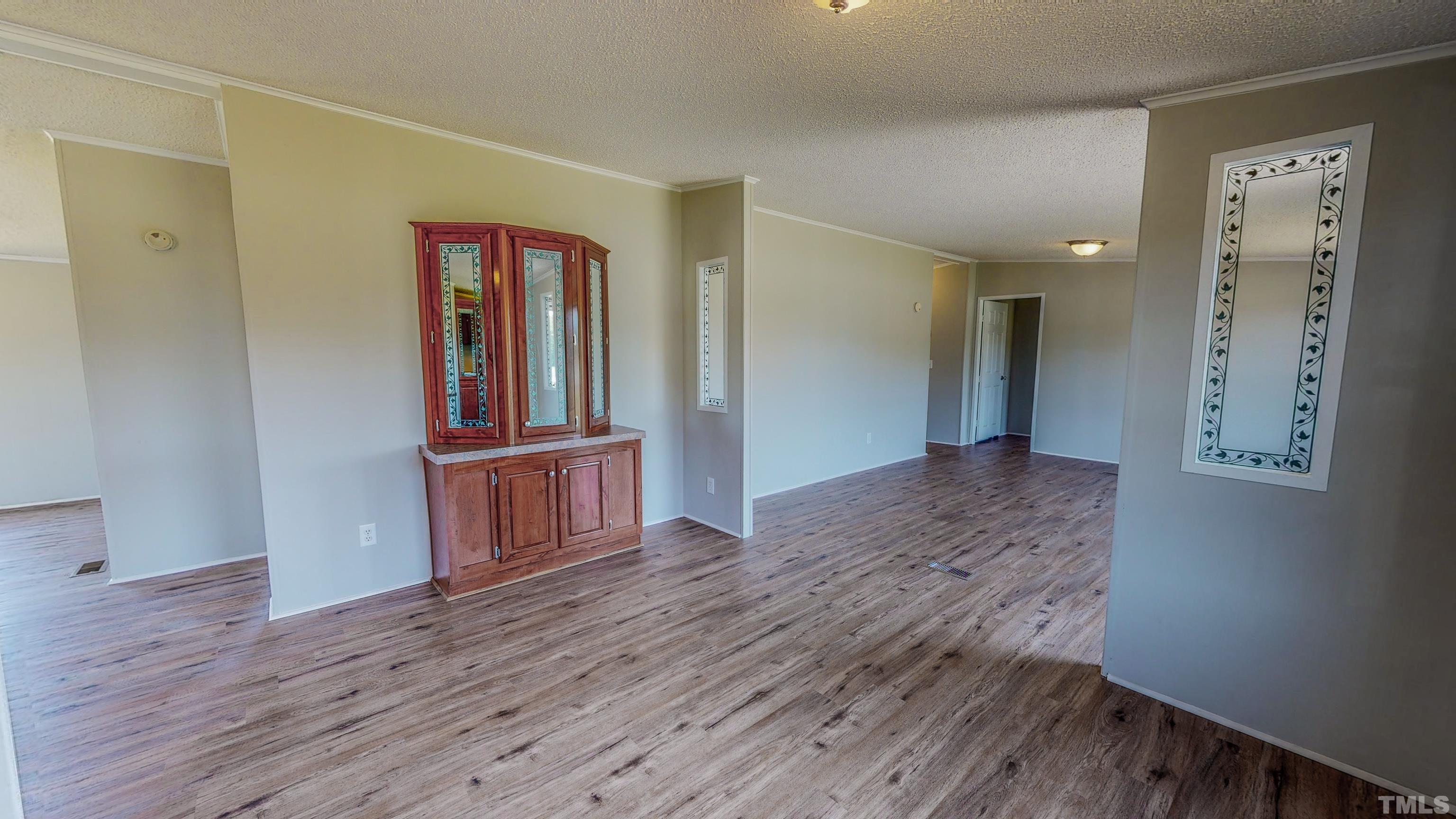 552 Huff Road Roxboro, NC 27574 - Photo 4 of 43 a view of a hallway with wooden floor