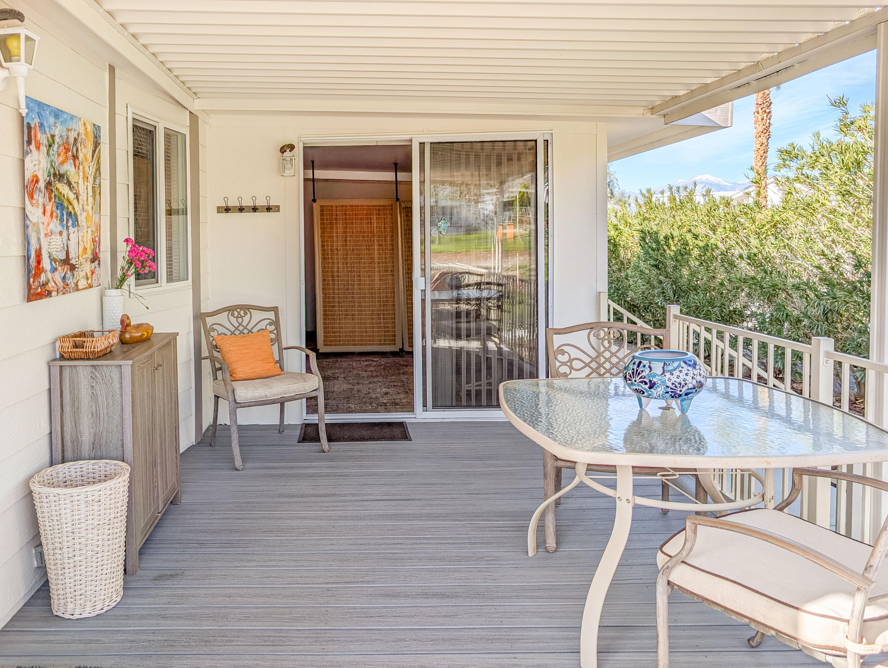 70200 Dillon Road, Unit 590 Desert Hot Springs, CA 92241 - Photo 12 of 42 a dining room with furniture and wooden floor