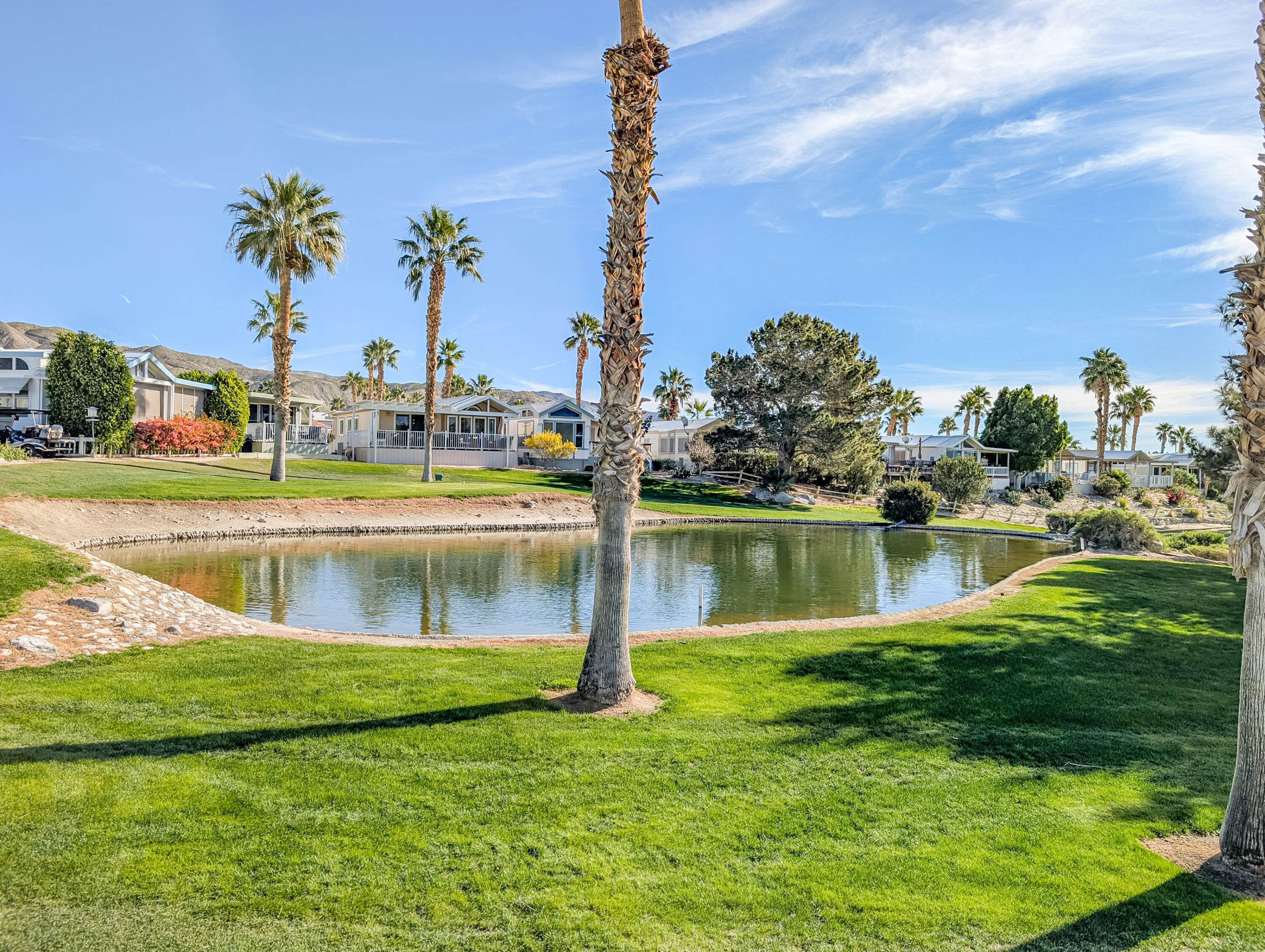 70200 Dillon Road, Unit 590 Desert Hot Springs, CA 92241 - Photo 15 of 42 a view of a lake with a big yard