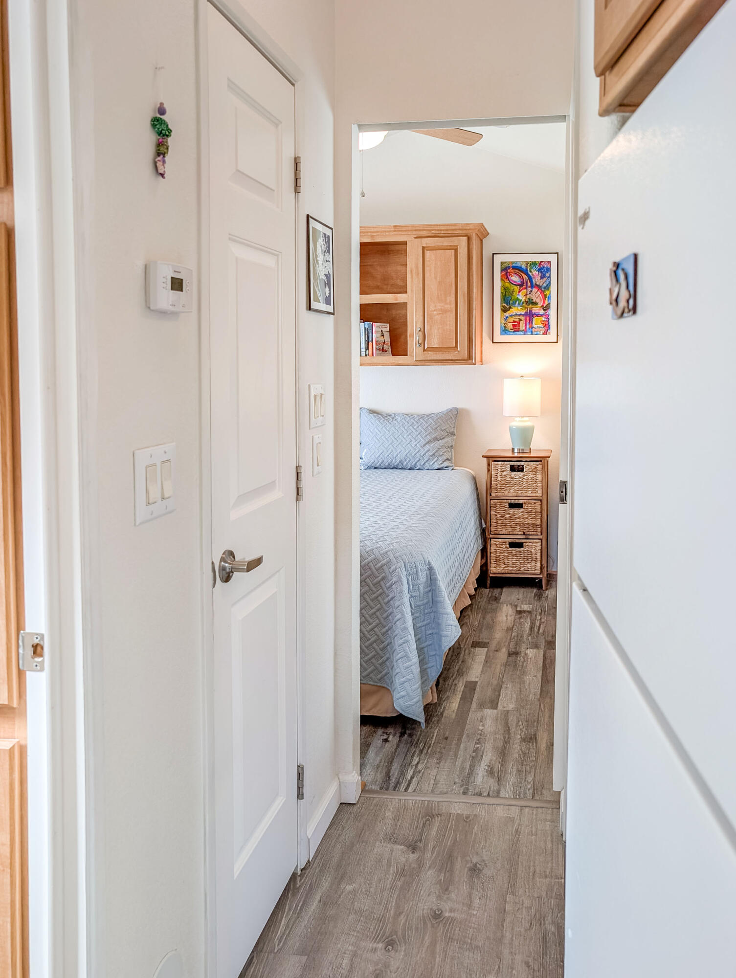 70200 Dillon Road, Unit 590 Desert Hot Springs, CA 92241 - Photo 31 of 42 a bed room with a bed and a refrigerator