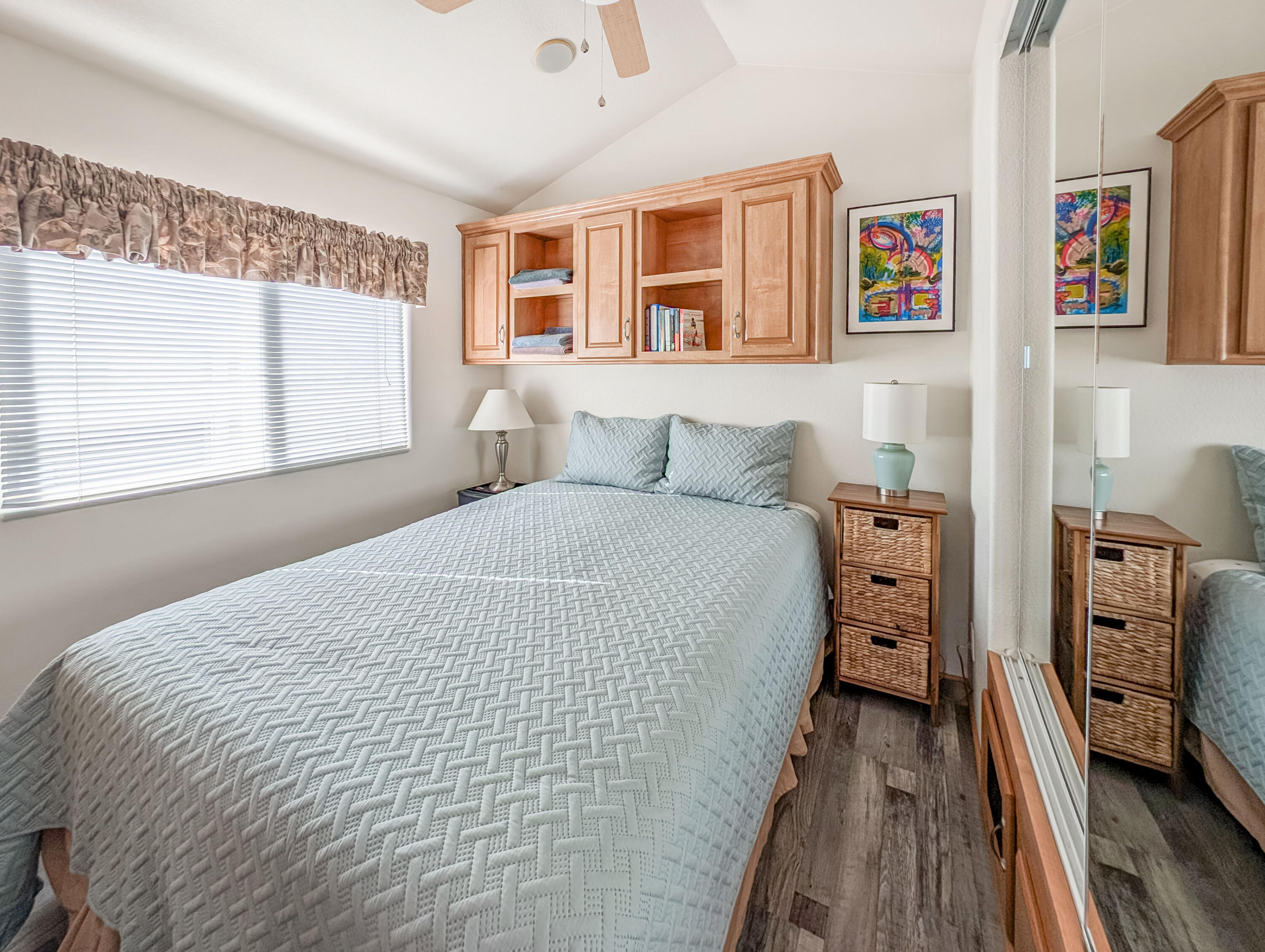 70200 Dillon Road, Unit 590 Desert Hot Springs, CA 92241 - Photo 32 of 42 a bedroom with a bed and a large window