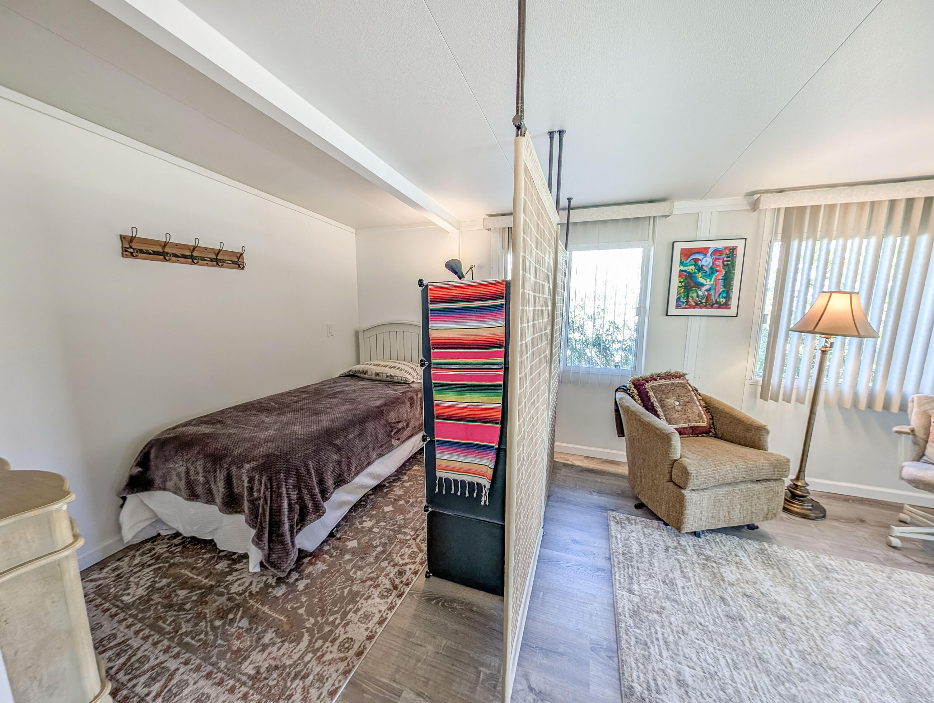 70200 Dillon Road, Unit 590 Desert Hot Springs, CA 92241 - Photo 37 of 42 a living room with furniture and a rug