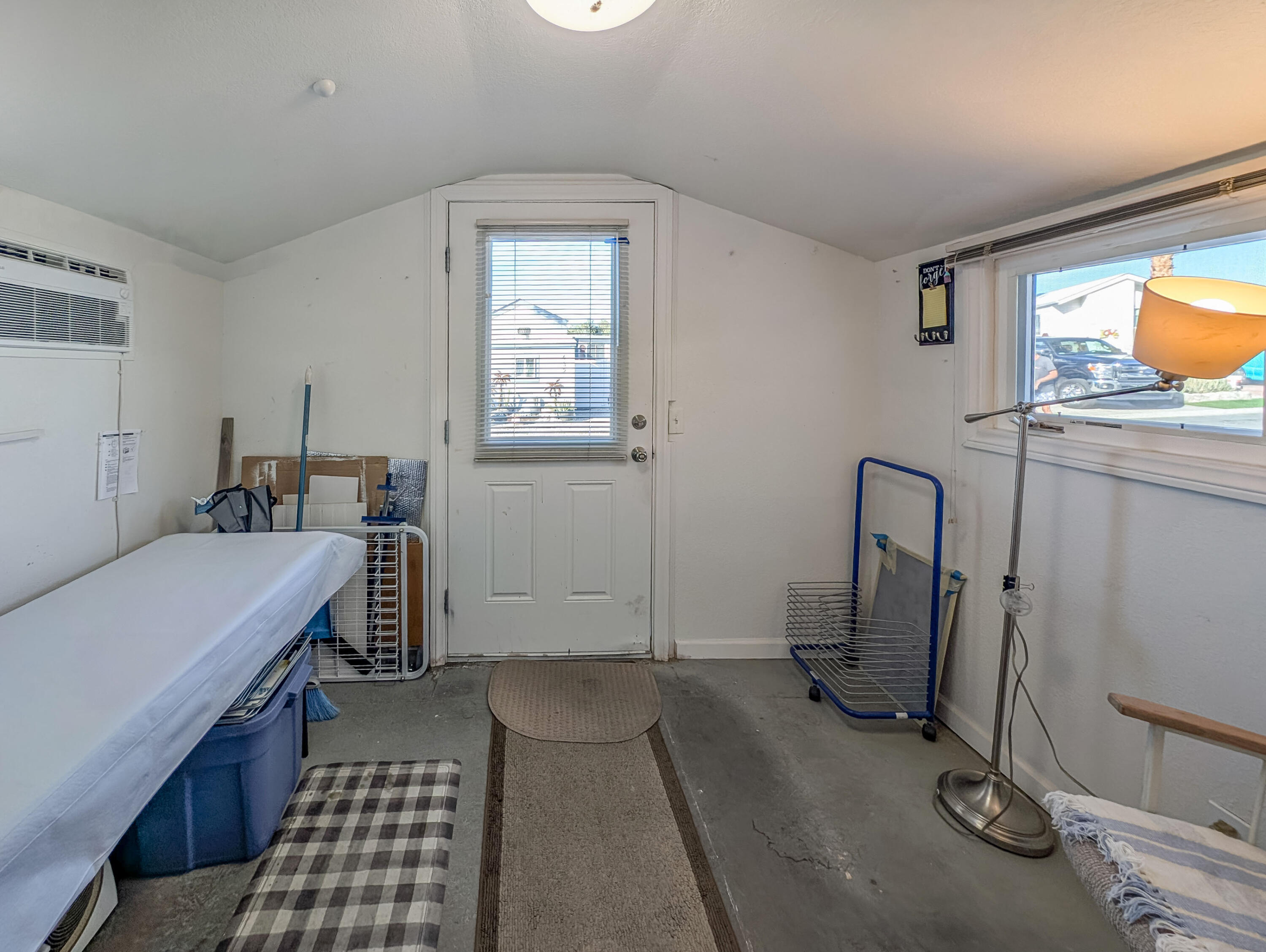 70200 Dillon Road, Unit 590 Desert Hot Springs, CA 92241 - Photo 6 of 42 a bedroom with a bed and wooden floor