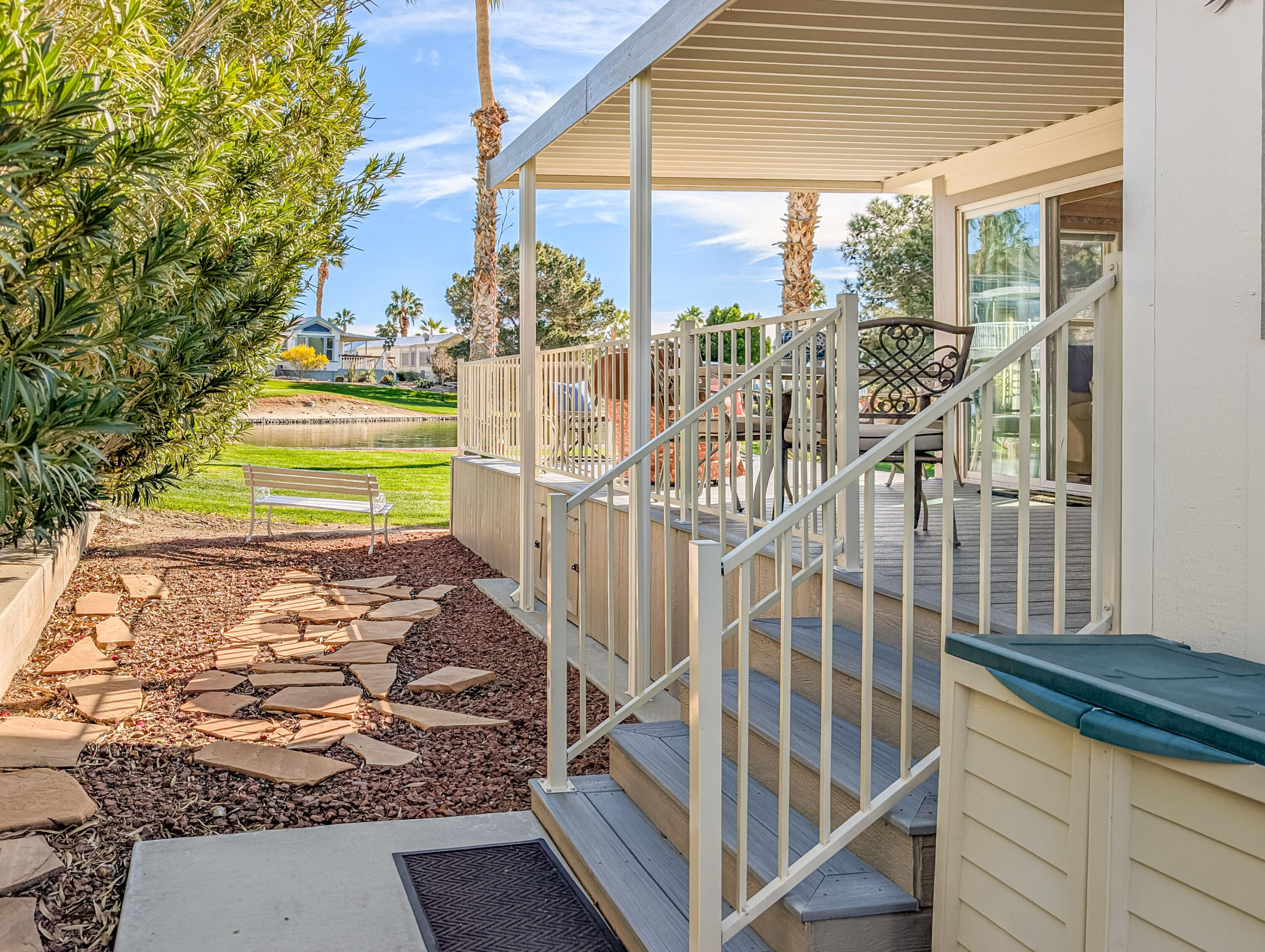 70200 Dillon Road, Unit 590 Desert Hot Springs, CA 92241 - Photo 10 of 42 a view of a room with wooden floor and windows