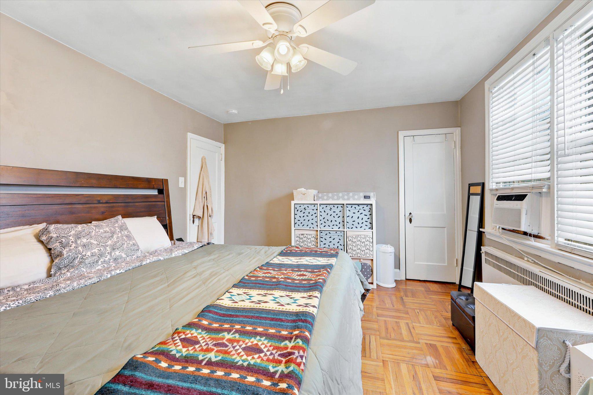 115 Academy Lane Upper Darby, PA 19082 - Photo 13 of 25 a bedroom with a bed and a chandelier
