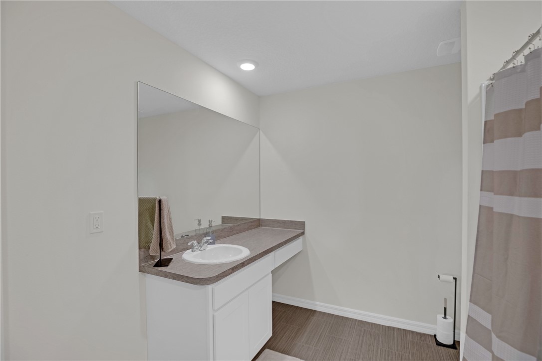 938 Clearmont Street Sebastian, FL 32958 - Photo 20 of 36 a bathroom with a sink and a mirror