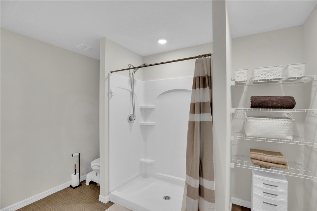 938 Clearmont Street Sebastian, FL 32958 - Photo 22 of 36 a bathroom with a shower and a glass door