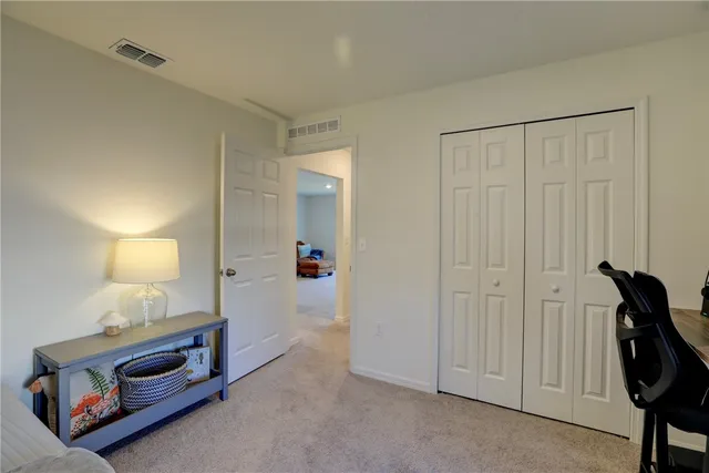 a view of room with furniture and lamp