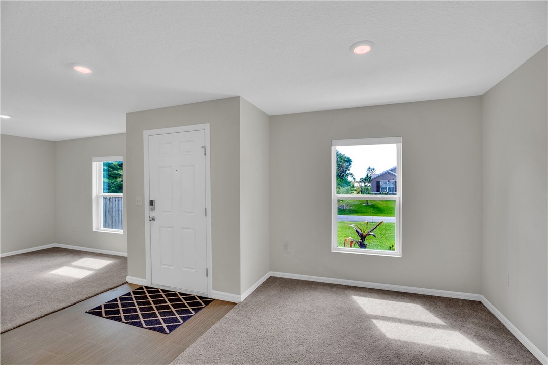 938 Clearmont Street Sebastian, FL 32958 - Photo 3 of 36 an empty room with windows and closet