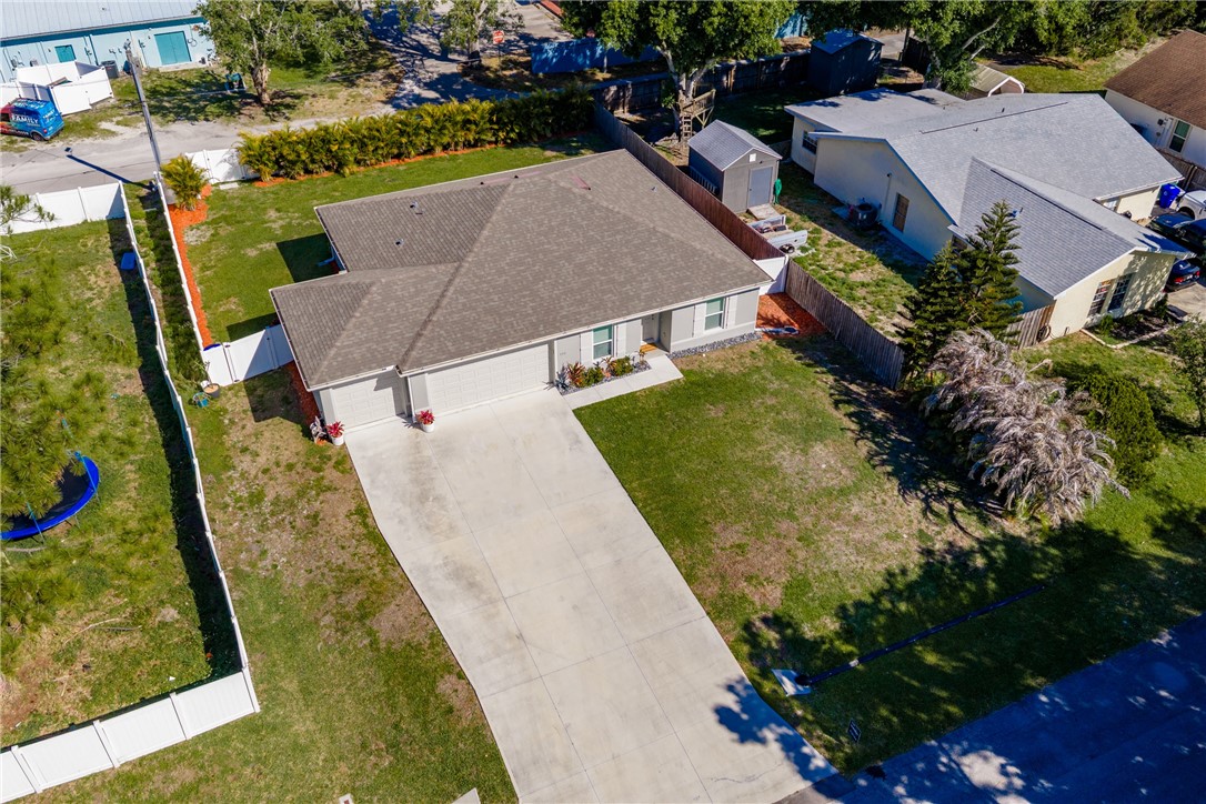 938 Clearmont Street Sebastian, FL 32958 - Photo 34 of 36 an aerial view of a house with a yard