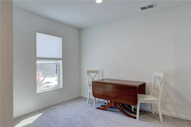 a room with a chair and a window